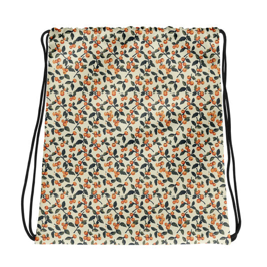 Drawstring bag with a floral pattern featuring red cherries on a beige background.