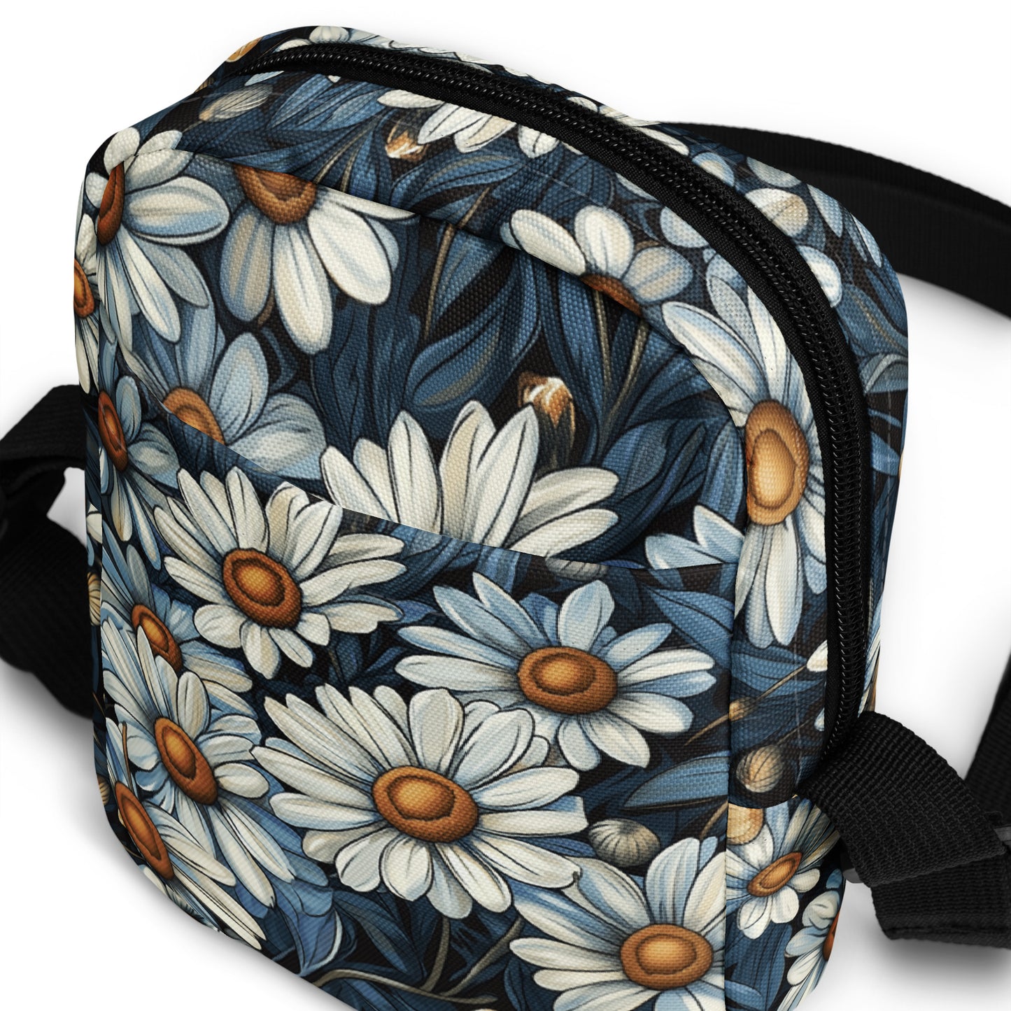 Floral patterned bag with a strap on a white background