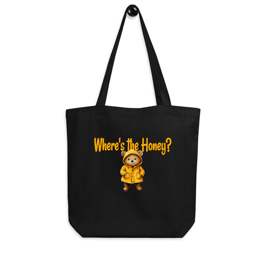 Black tote bag with a bear in a yellow raincoat and text 'Where's the Honey?' on a white background.