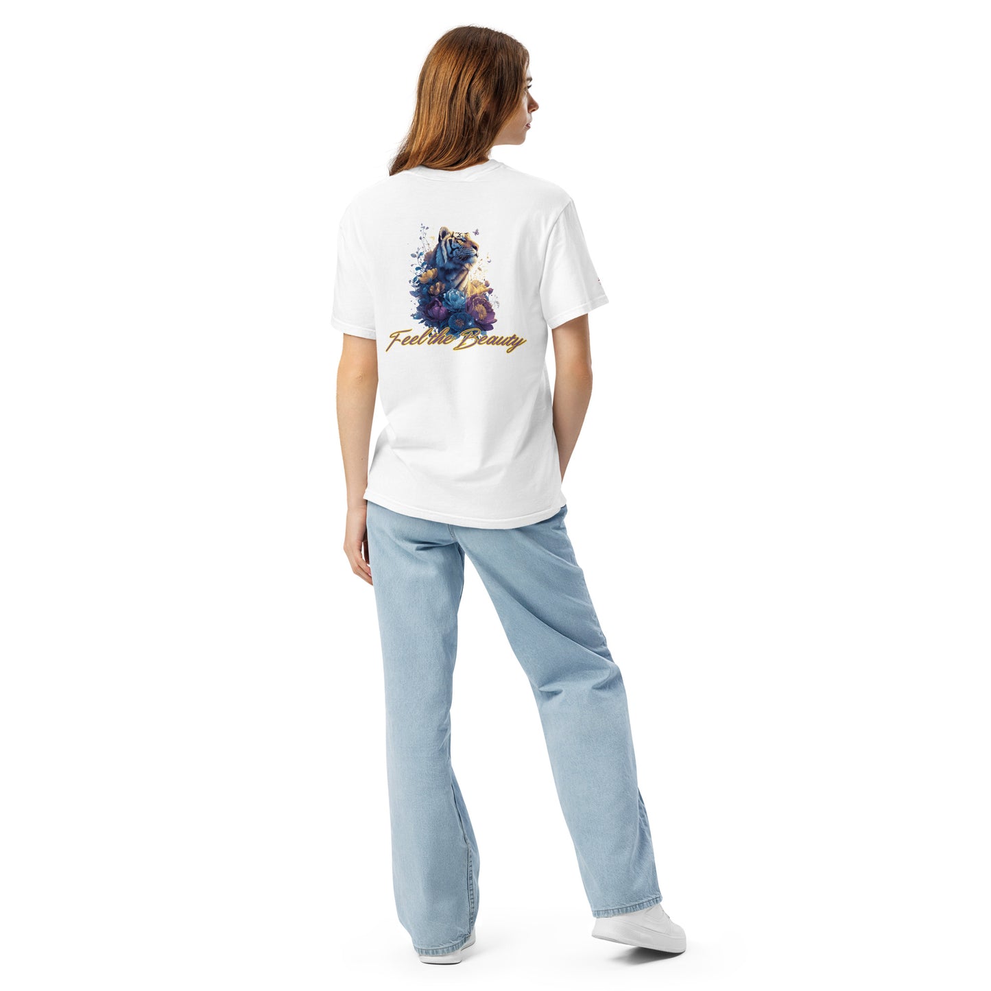 Young woman wearing a white t-shirt with a colorful design and text, standing against a white background