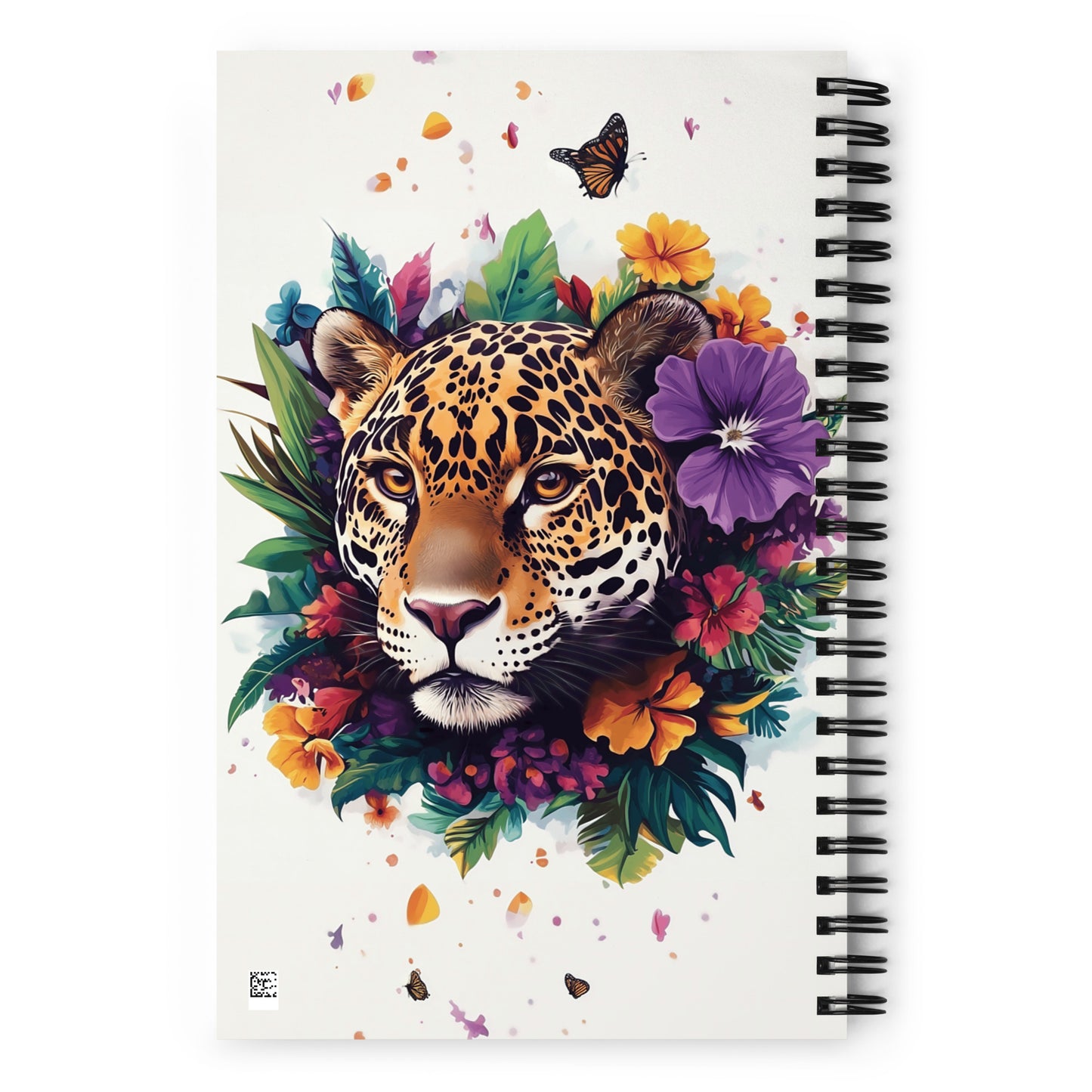 Spiral notebook with a jaguar design surrounded by colorful flowers and leaves on a white background.