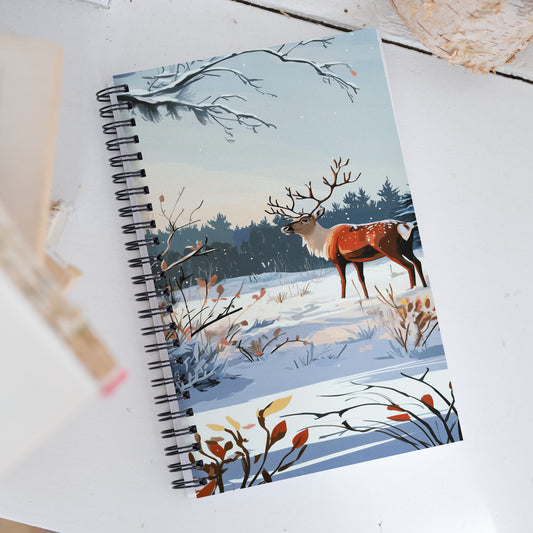 Spiral notebook featuring a serene winter scene with a majestic stag in a snowy field.
