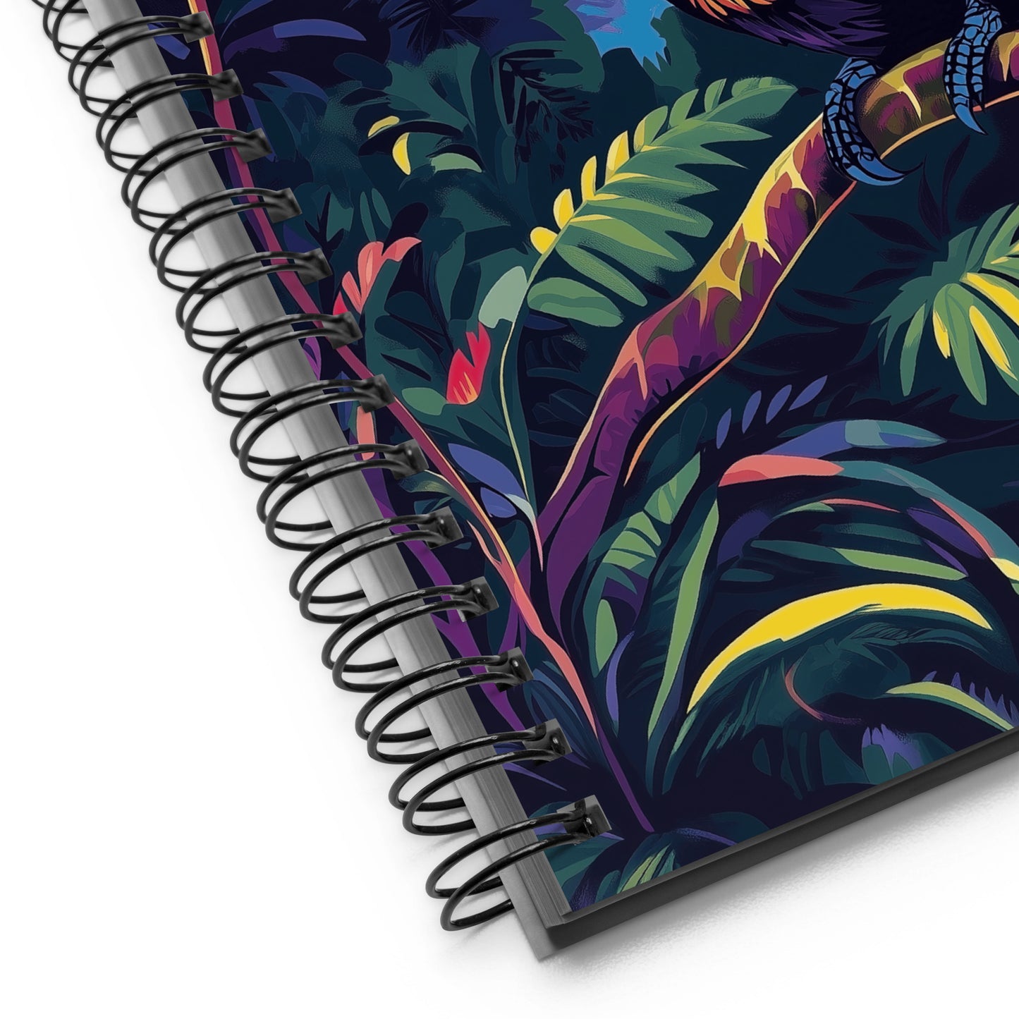 Spiral-bound notebook with a colorful tropical leaf design on a white background.