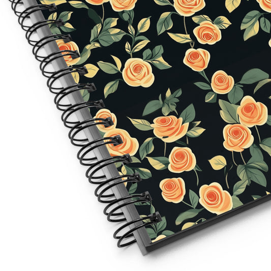 Spiral notebook with roses design by Sweet and Savage on a white background.