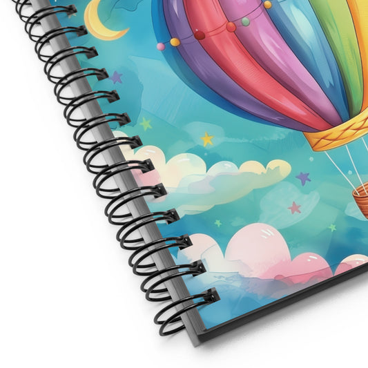 Close up of spiral notebook with a colorful hot air balloon design on the cover by Sweet and Savage.
