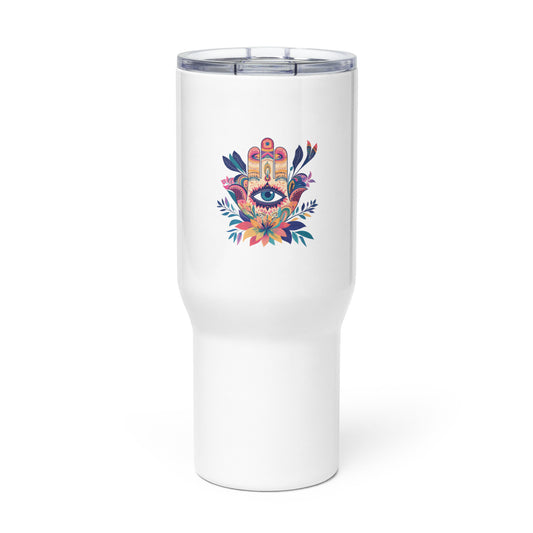 Large white travel mug with a handle featuring a colorful Hamsa hand art print on a table.