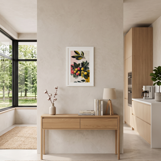Modern interior with a wooden desk, framed artwork by Sweet & Savage, and kitchen area that has a Scandinavian decor. 