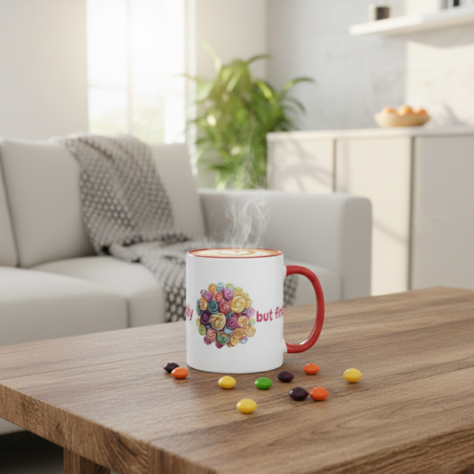 A lifestyle mockup of a white ceramic mug with a red interior and handle, sitting on a rustic wooden coffee table. The mug features a colorful 'I Want Candy, but First Coffee' lollipop graphic and is filled with steaming latte art. Scattered around the base of the mug are several vibrant, multi-colored round candies. 