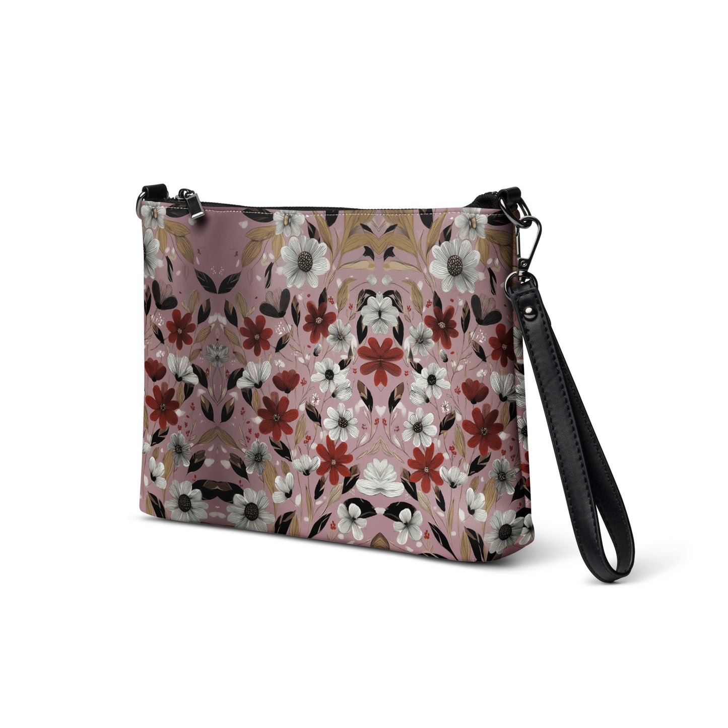 Floral patterned crossbody bag with black strap on a white background. 