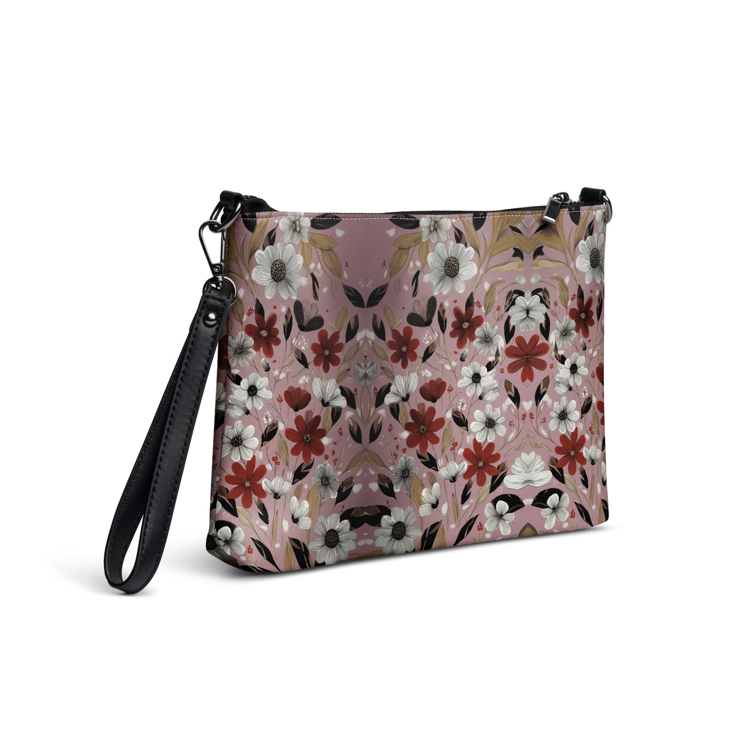 Floral patterned crossbody bag with black strap on a white background. 