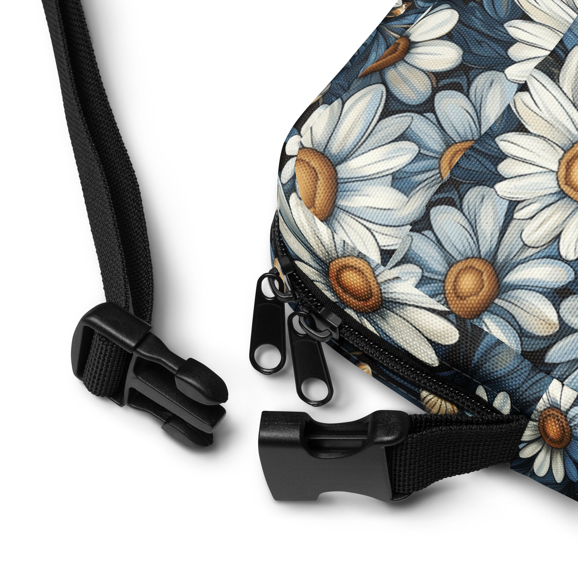 Floral-patterned bag with black strap and zipper on a white background
