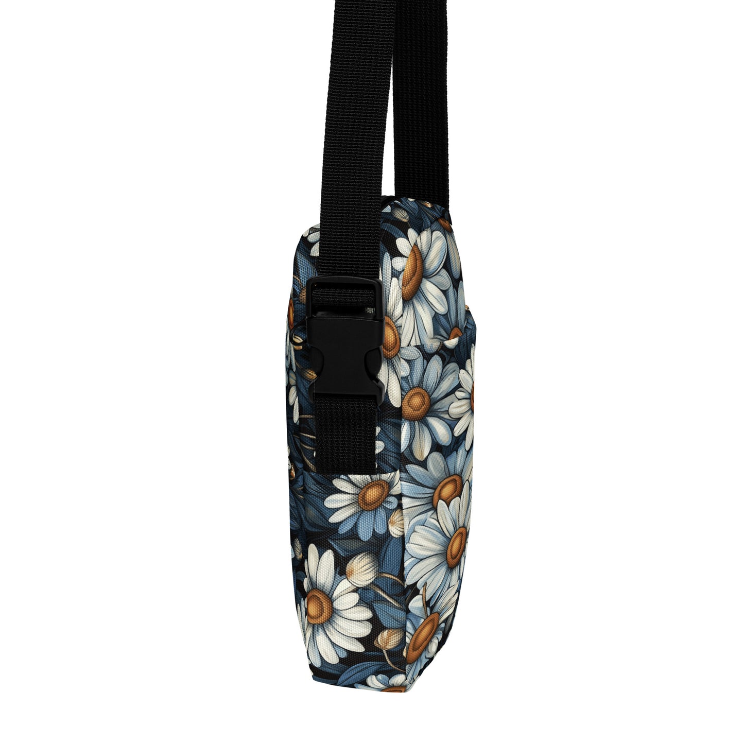 Floral-patterned pouch with a black strap on a white background