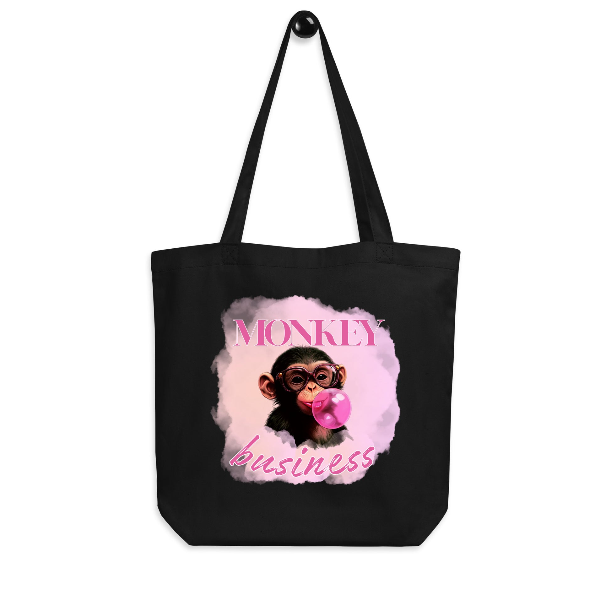 Sustainable black cotton tote bag featuring the 'Monkey Business' chimpanzee artwork, durable and spacious for eco-conscious daily use
