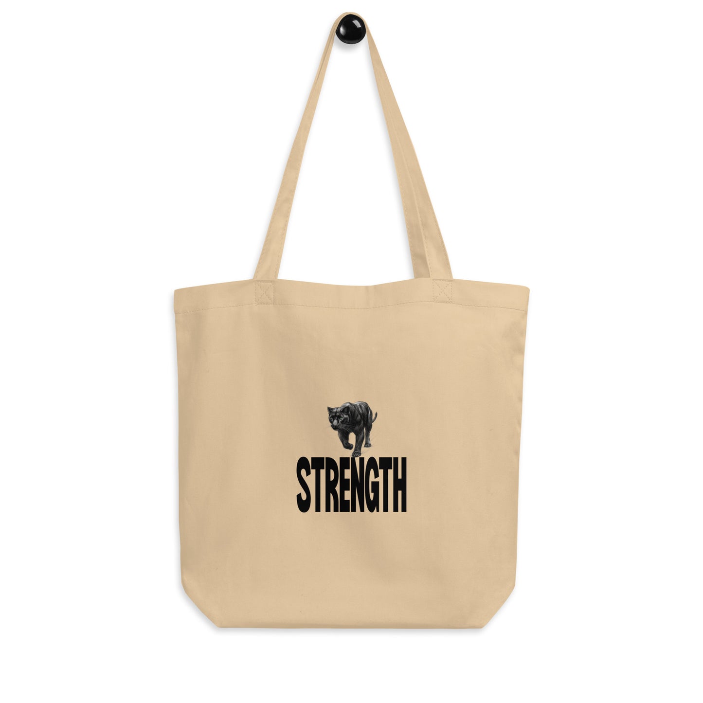 An organic cotton tote bag featuring a black panther and the word"STRENGTH". 