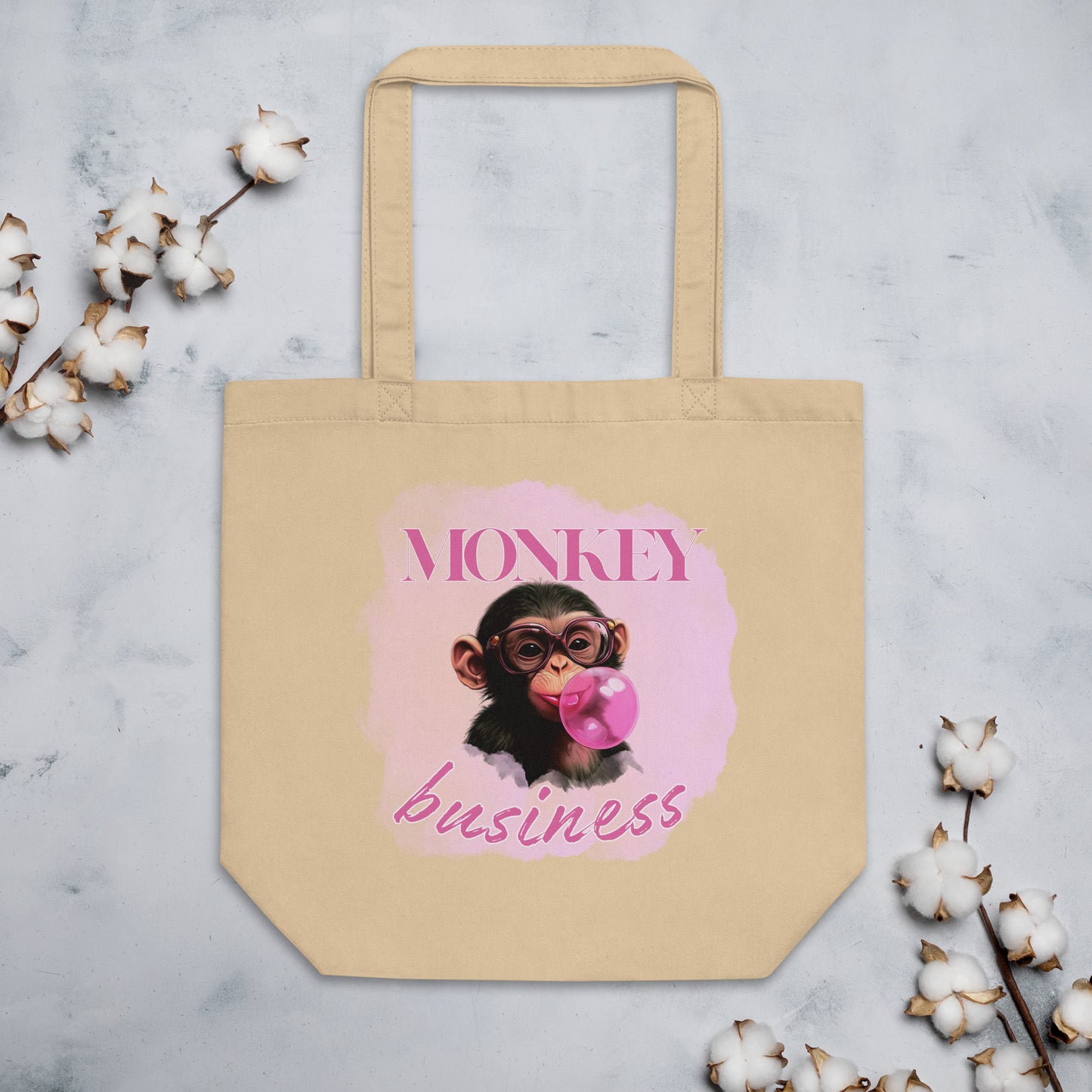 Sustainable oyster cotton tote bag featuring the 'Monkey Business' chimpanzee artwork, durable and spacious for eco-conscious daily use