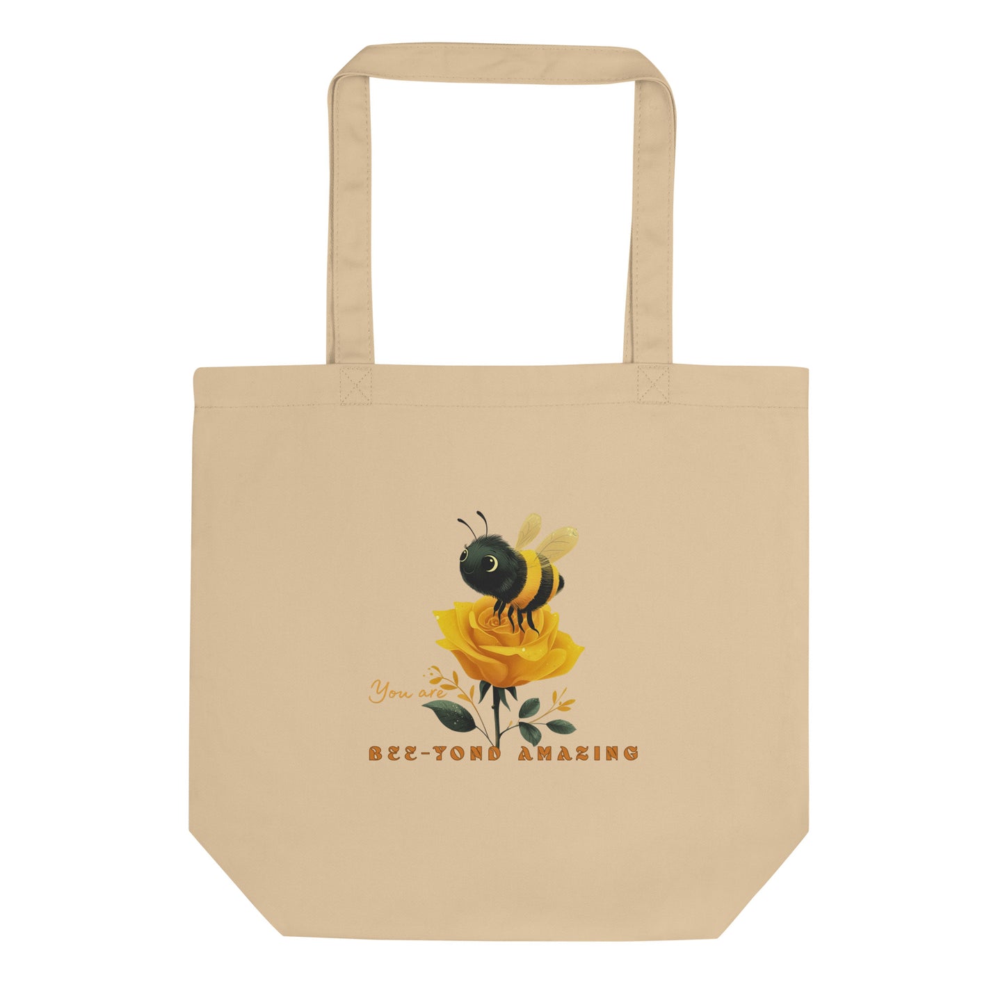 Beige eco tote bag with a bee and rose yellow rose design with the words 'You are Bee-yond amazing' on a white background. 