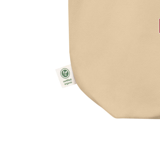 Beige fabric with a certified organic label on a white background