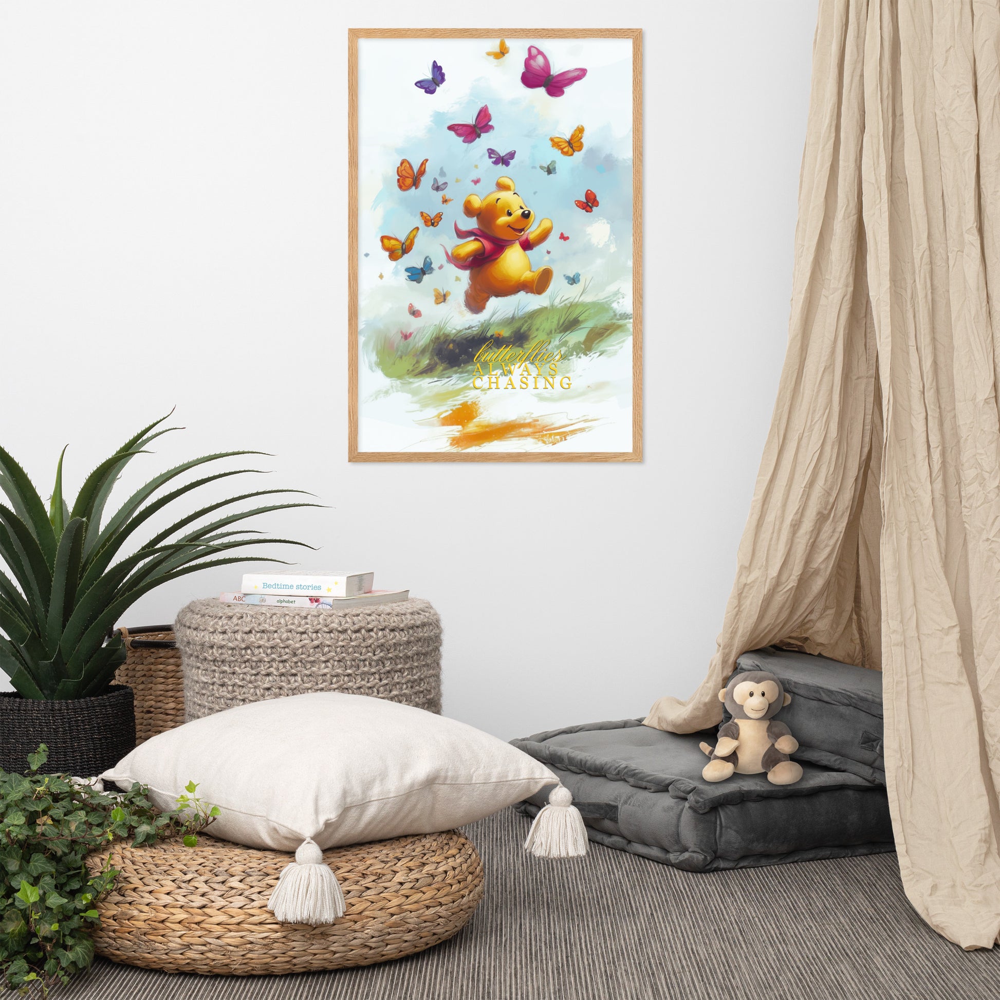 Room interior with a framed poster of Winnie the Pooh and butterflies, a pouf, pillow, and plant.