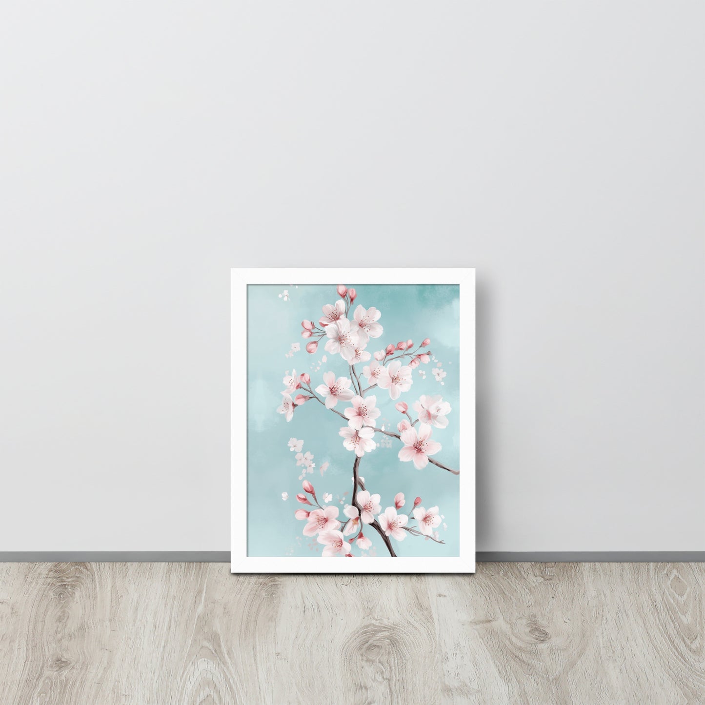 Framed poster of cherry blossoms on a light blue background by Sweet and Savage. 