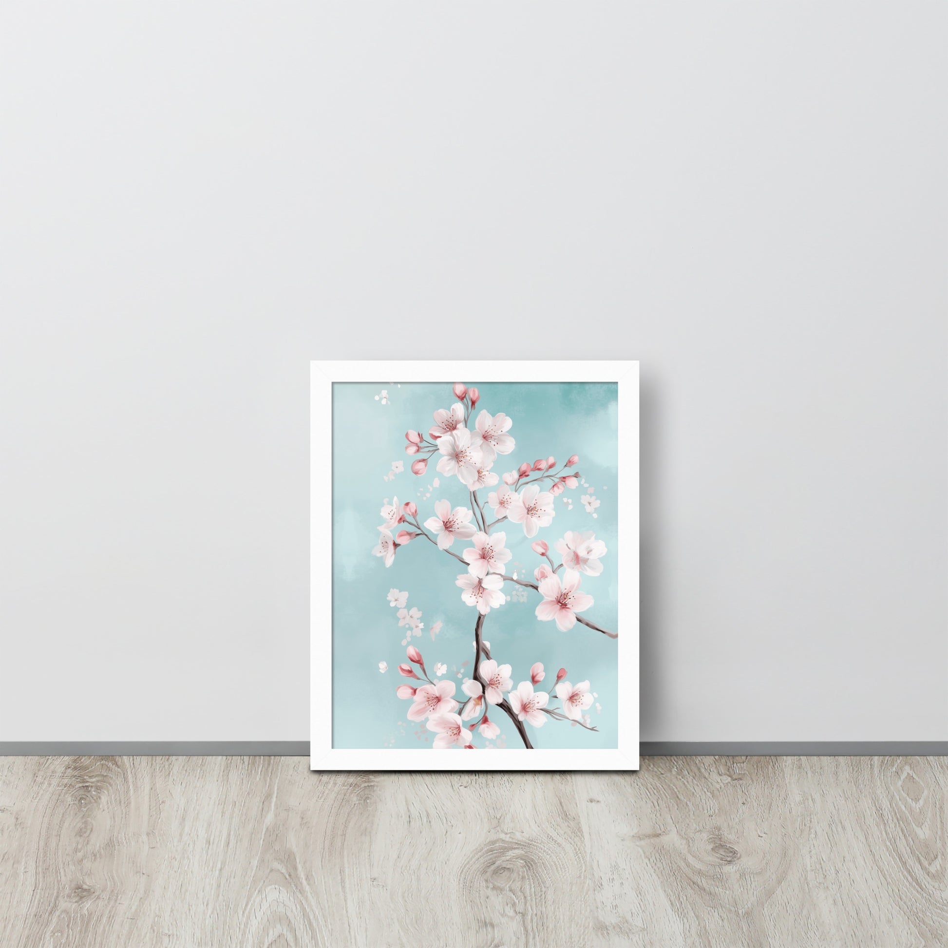 Framed poster of cherry blossoms on a light blue background by Sweet and Savage. 