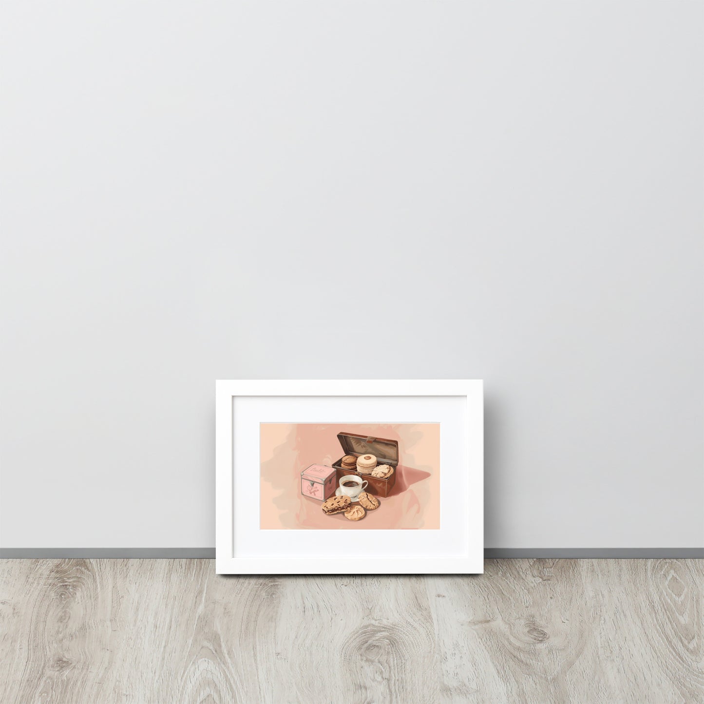 Framed poster illustrating a cookie box and a cup of coffee on a light pink background by Sweet and Savage. 