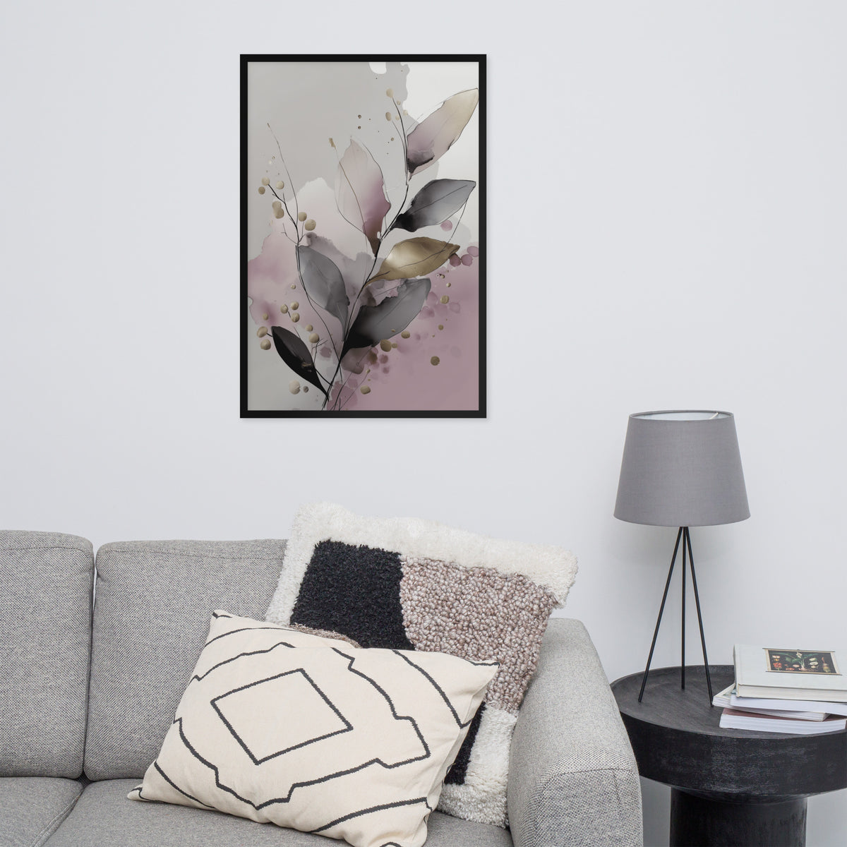 Framed floral art print on a wall above a gray sofa with decorative pillows.