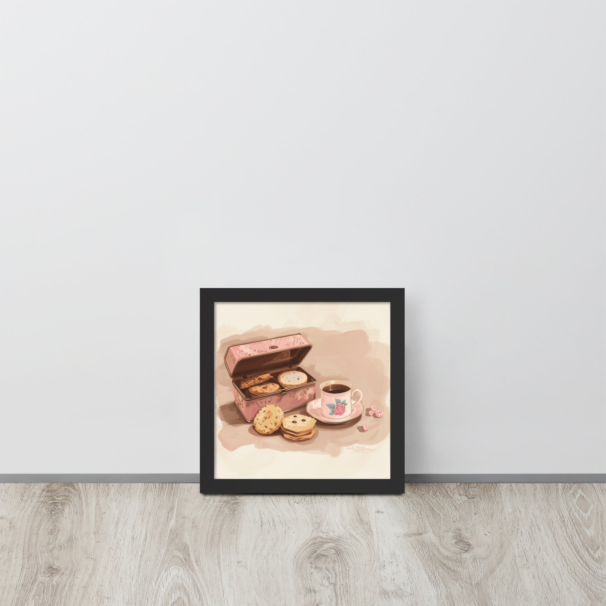 Framed hygge-themed poster with a black mat border featuring a pink coffee cup, cookies, and a cozy indoor setting.