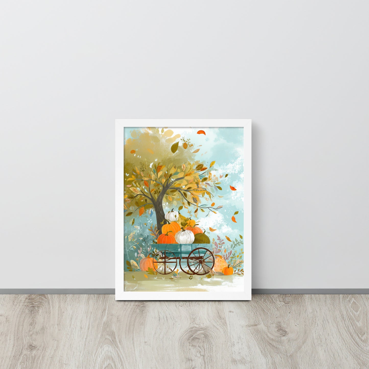 Framed poster of a tree with pumpkins and a cart on a light gray wall by Sweet and Savage. 