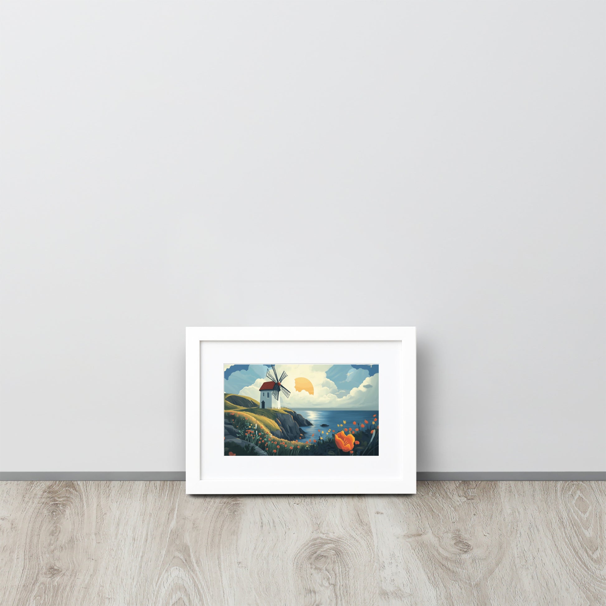 Framed poster of a windmill by the sea on a white background by Sweet and Savage. 