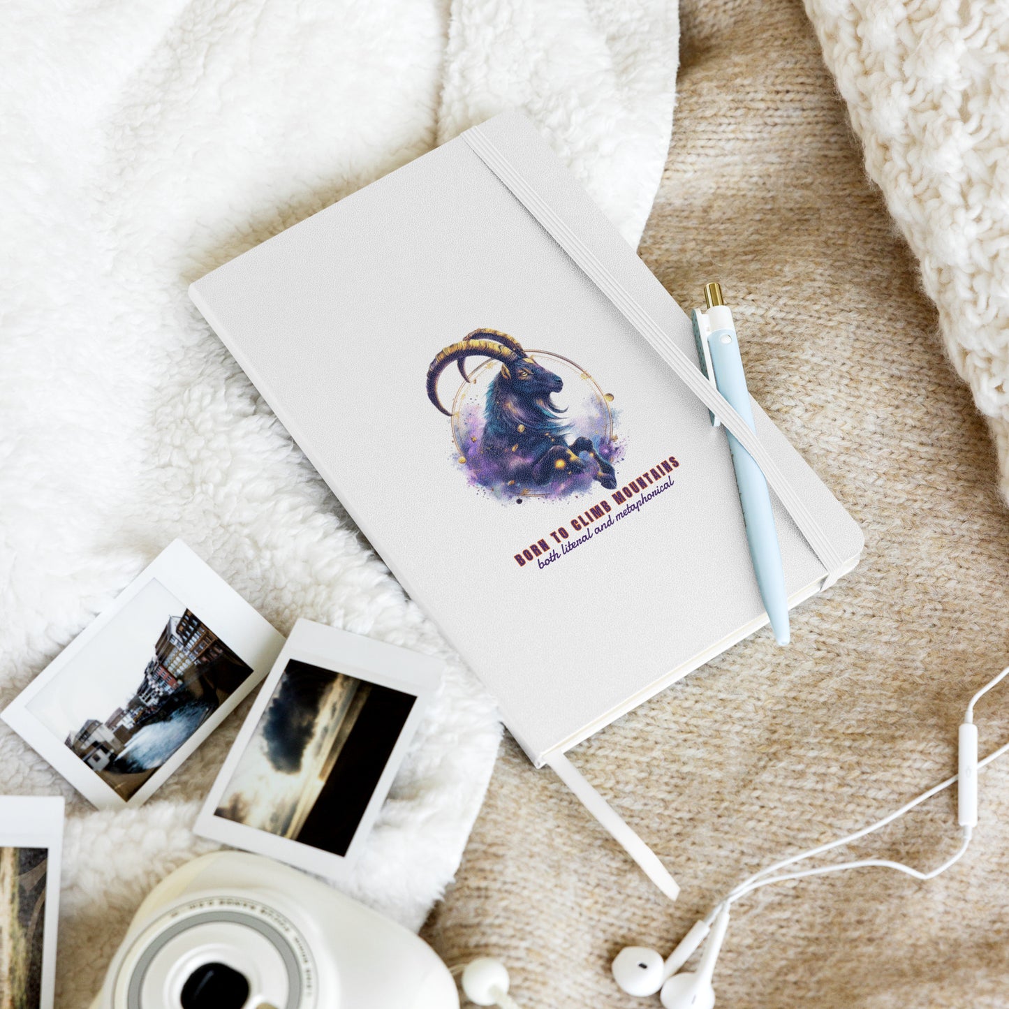 White hardcover notebook featuring a colorful, artistic Capricorn zodiac goat design by Sweet & Savage.