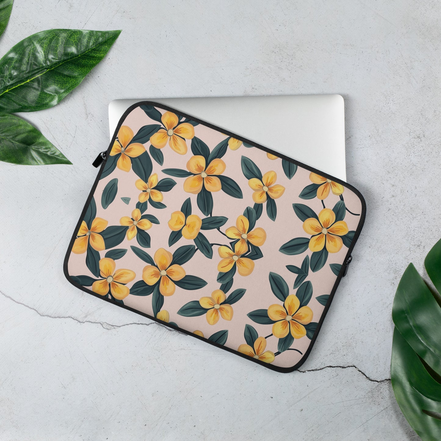 Padded 13 inch laptop sleeve featuring a vibrant yellow and blue periwinkle floral pattern.