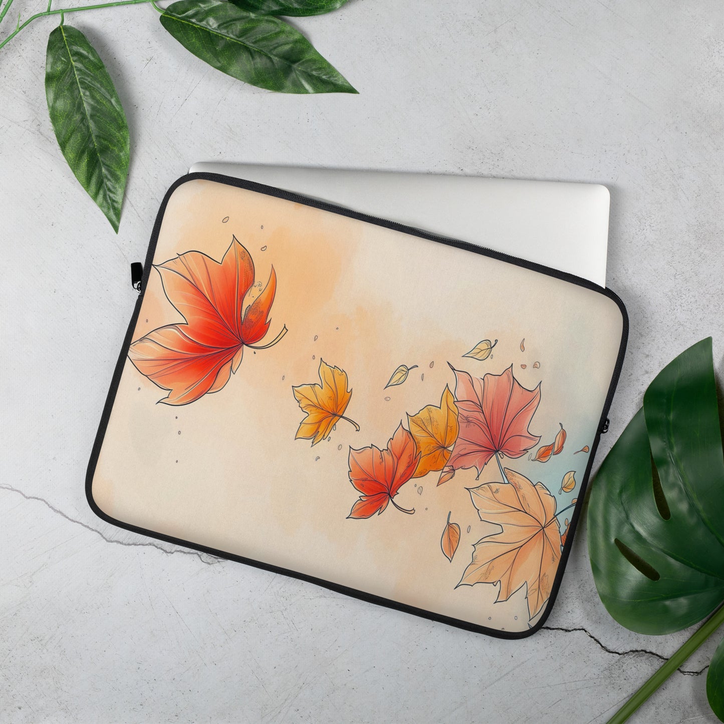 A laptop sleeve featuring an autumn watercolor design with red, orange, and yellow maple leaves by Sweet & Savage on a light beige background, finished with a black zipper border.