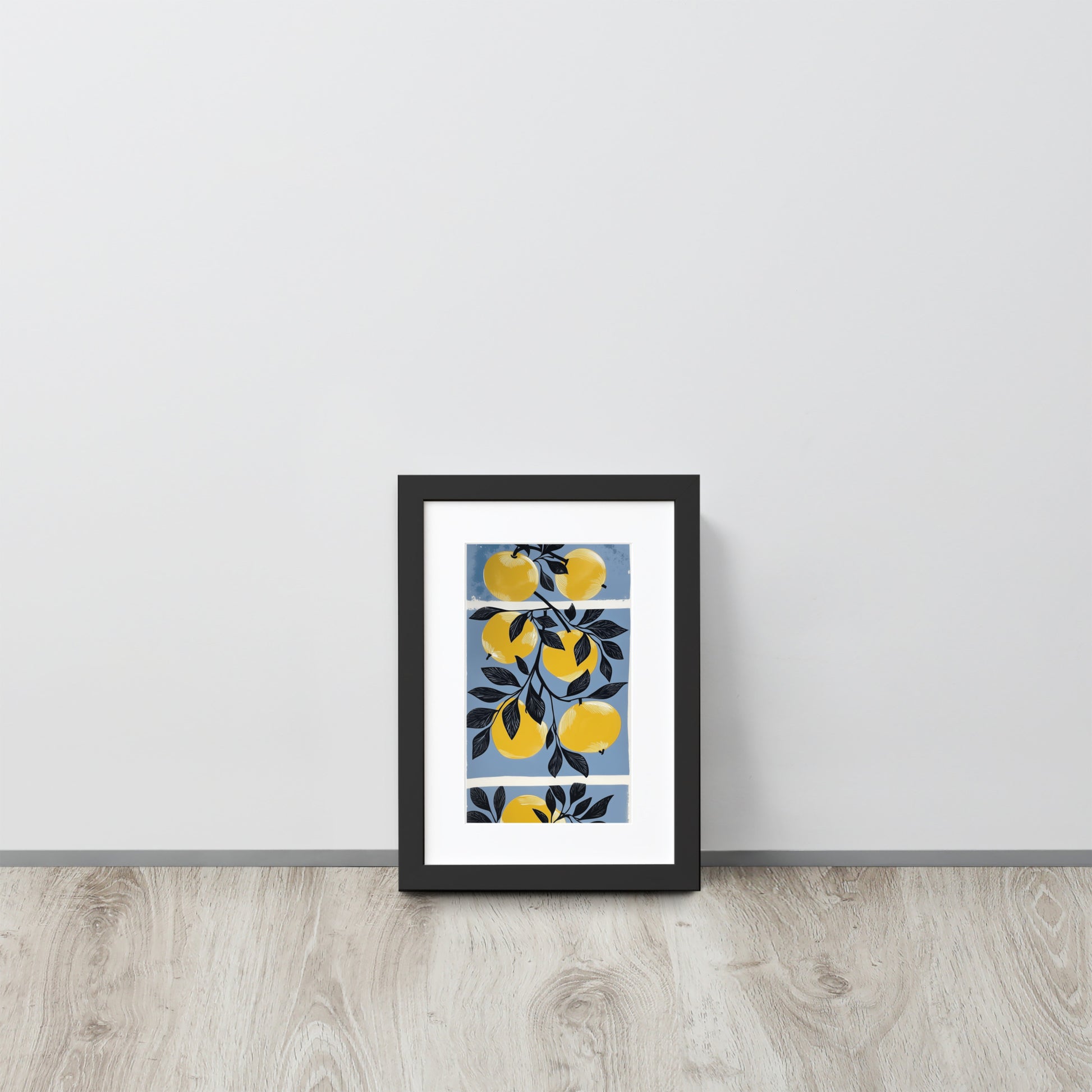 Framed poster with yellow apple design on a white wall.