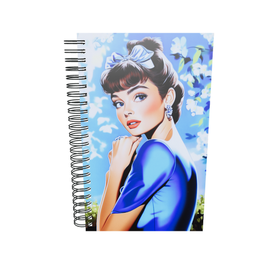 Spiral notebook with a secret garden floral and style icon graphic.