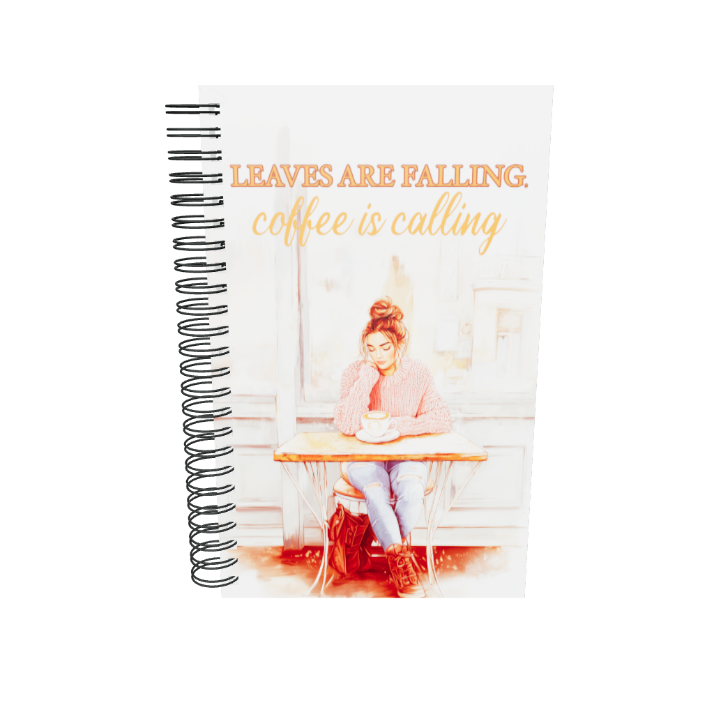 Spiral notebook with 'Leaves Are Falling, Coffee Is Calling' autumn illustration. Mockup shows a girl in a pink sweater at a café. Premium stationery for journaling and sketching.