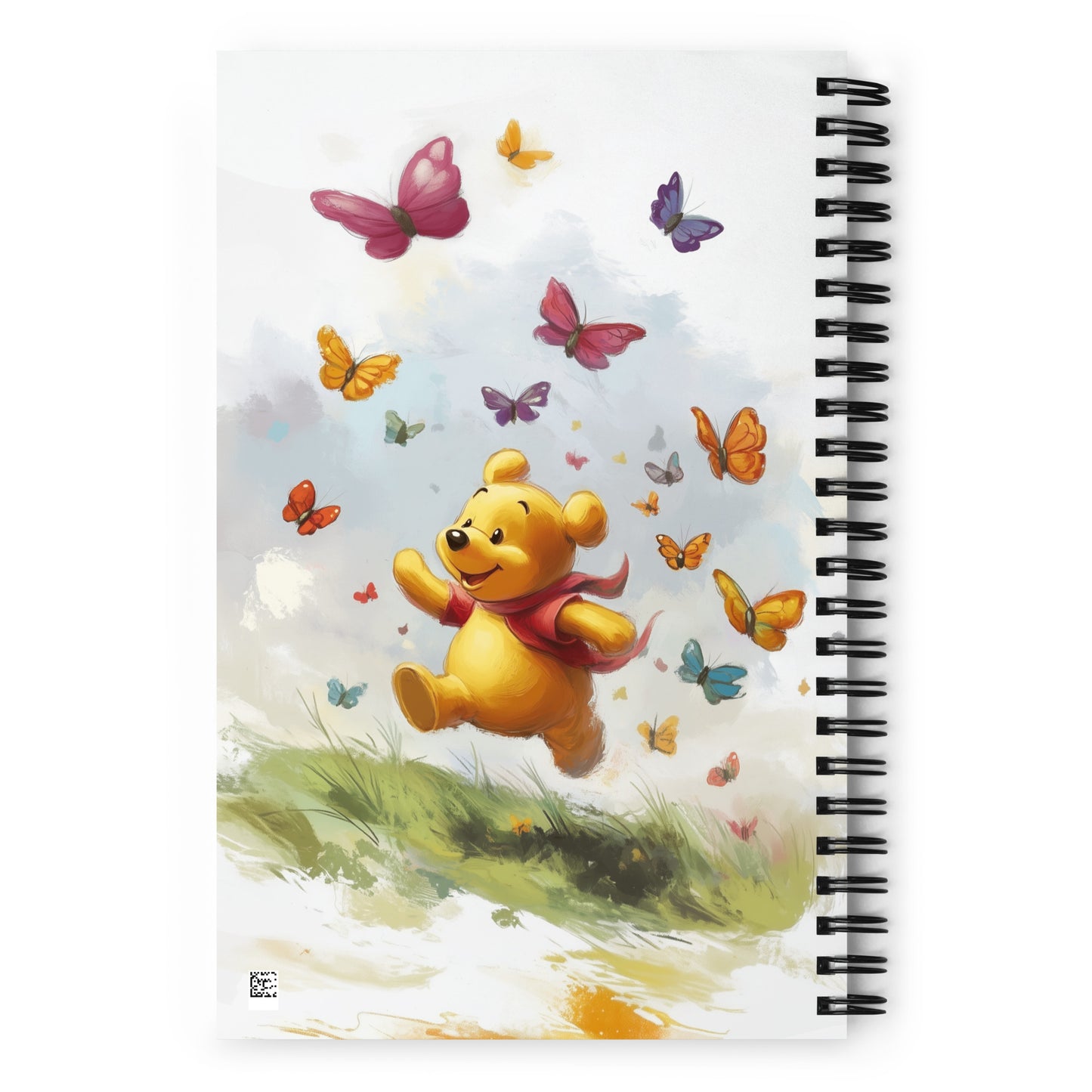 Spiral notebook with Winnie the Pooh design on a white background. 