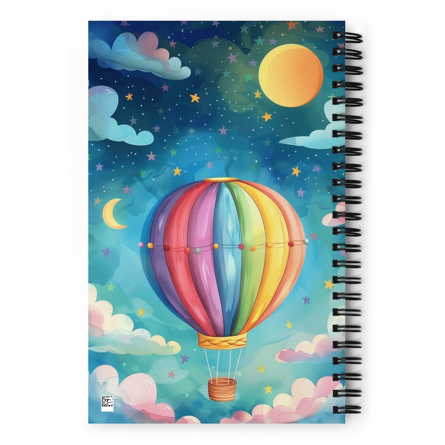 Spiral notebook with a colorful hot air balloon design in the blue skies on a white background. 