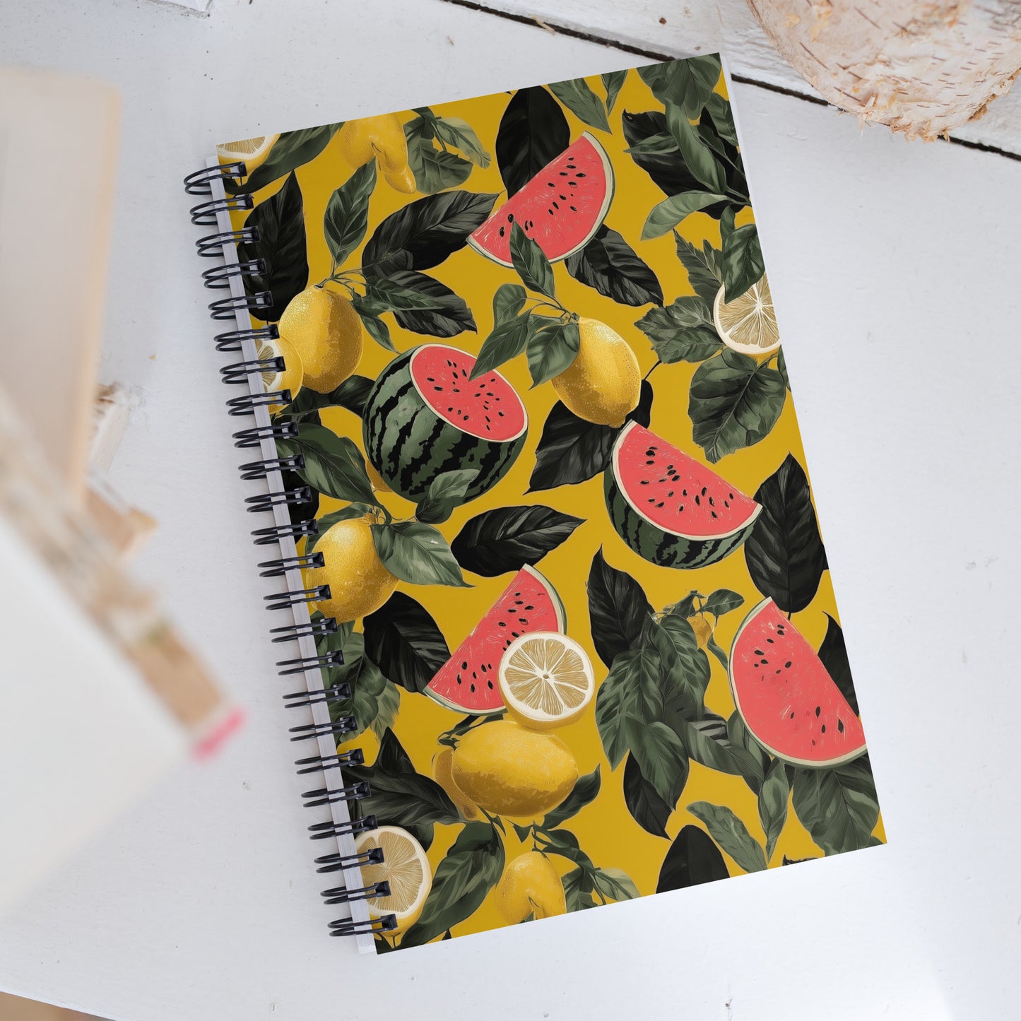 Spiral notebook with pattern of watermelon and lemons on a light background. 