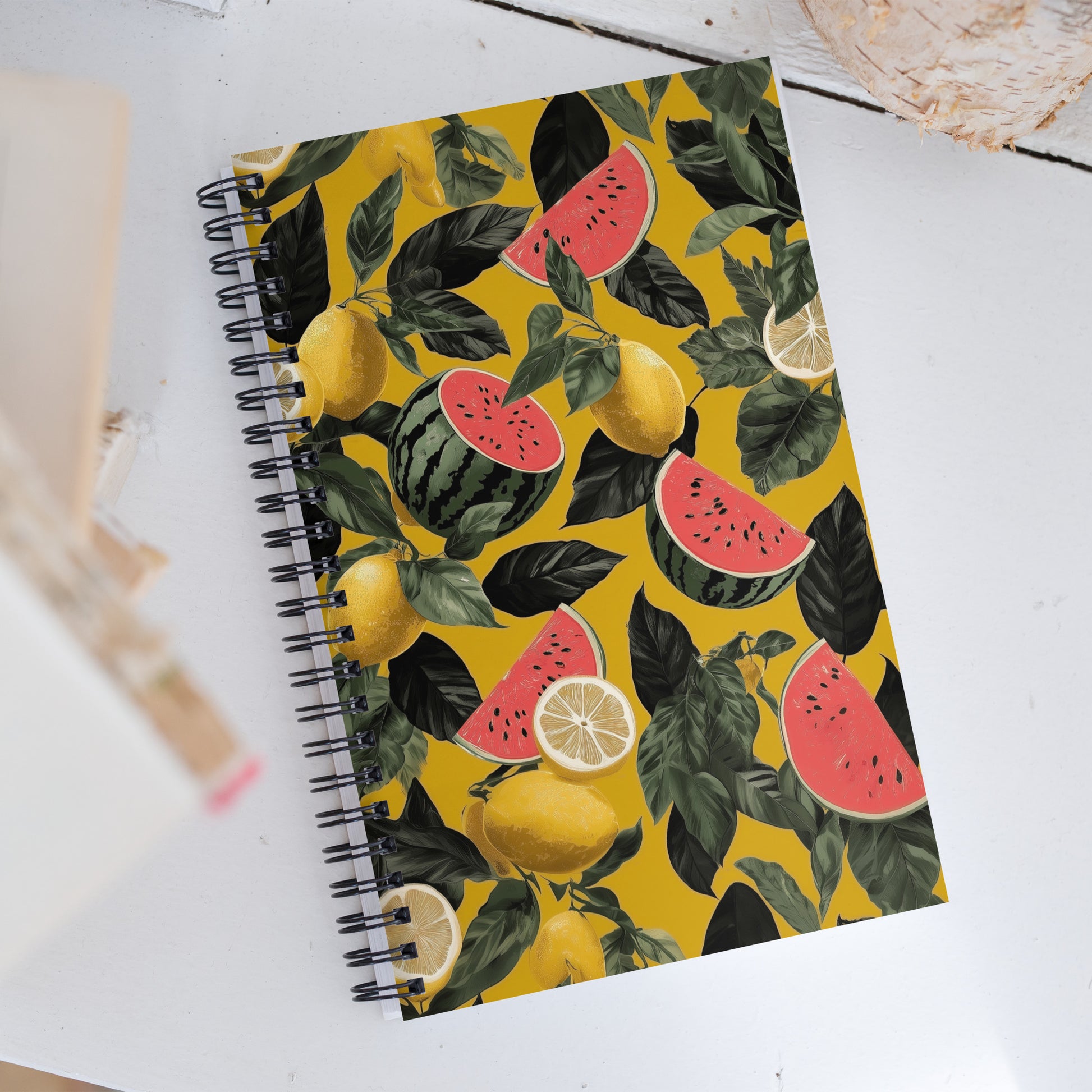 Spiral notebook with pattern of watermelon and lemons on a light background. 