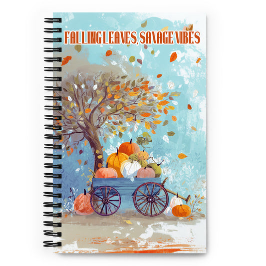 Spiral notebook with autumn design featuring pumpkins and a tree, titled 'Falling Leaves Savage Vibes'.