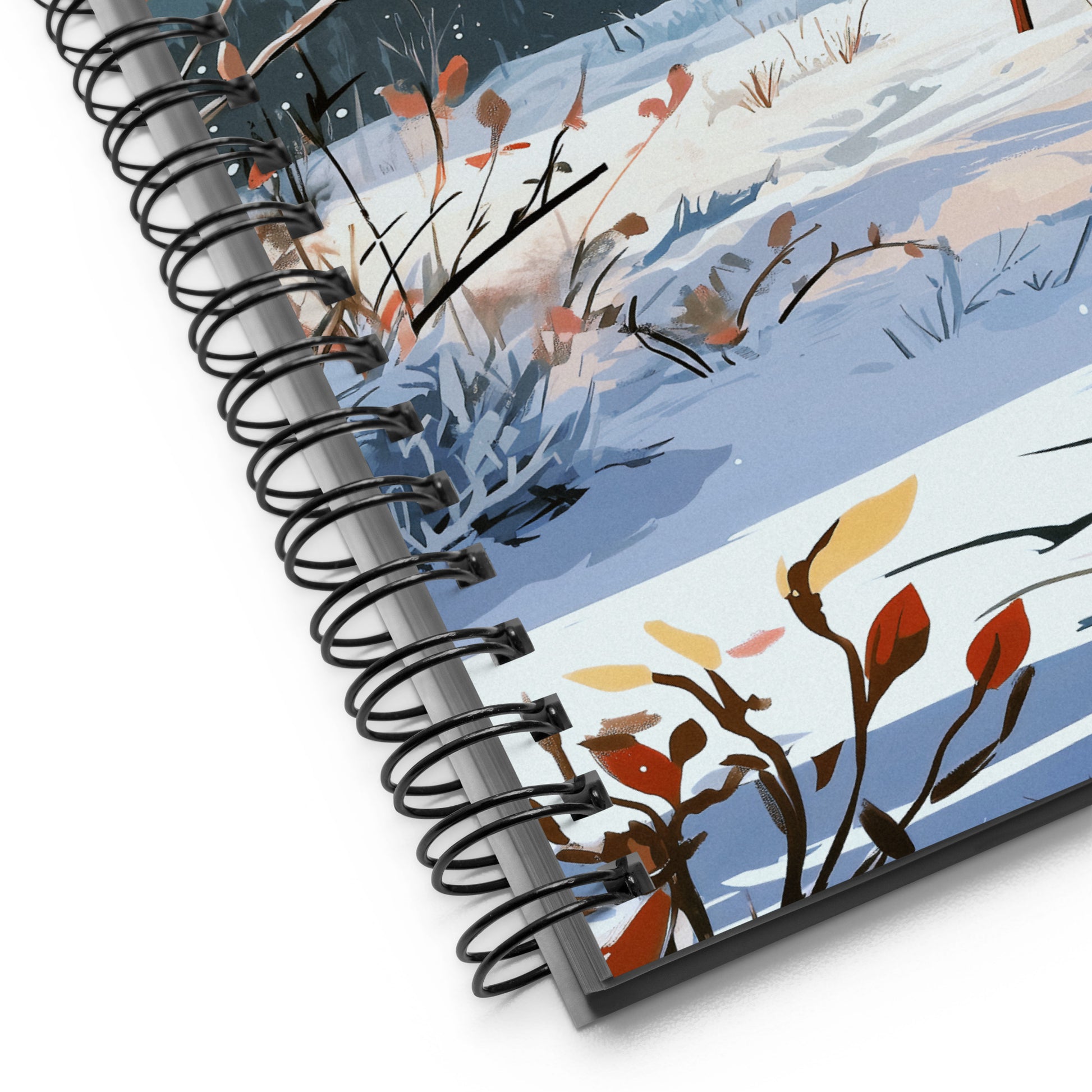 Spiral notebook featuring a serene winter scene with a majestic stag in a snowy field.