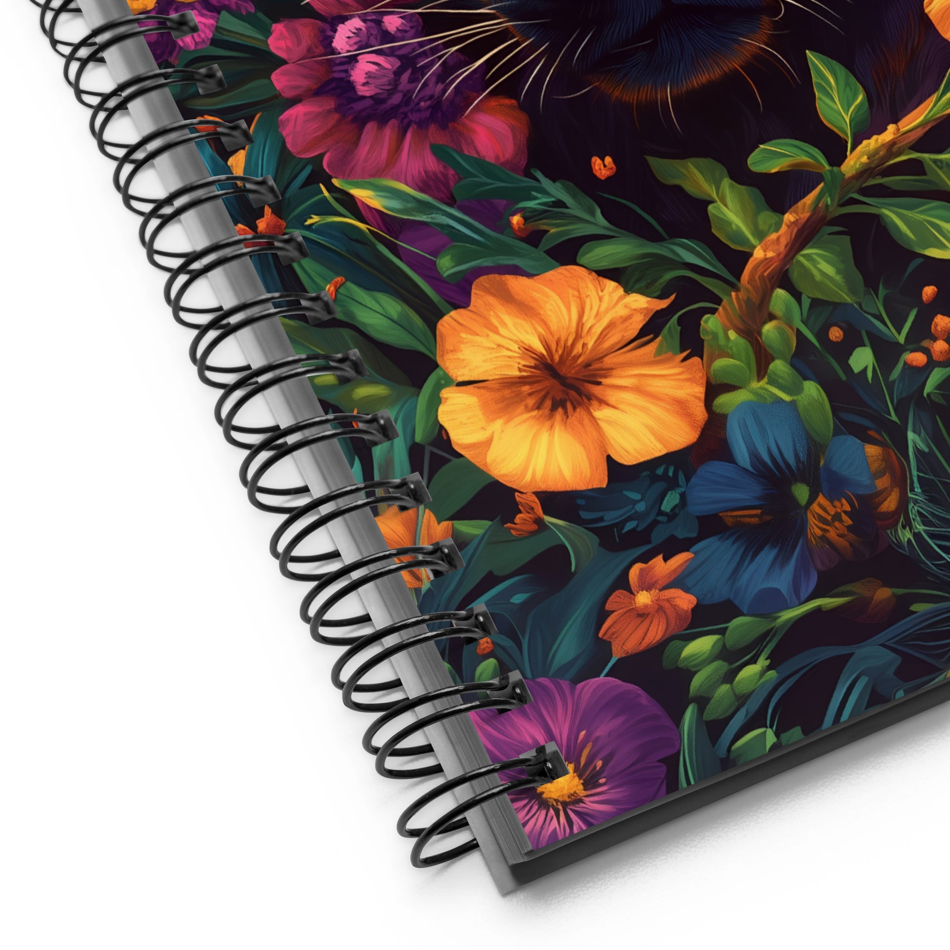 Spiral notebook with a colorful floral design on a white background. 