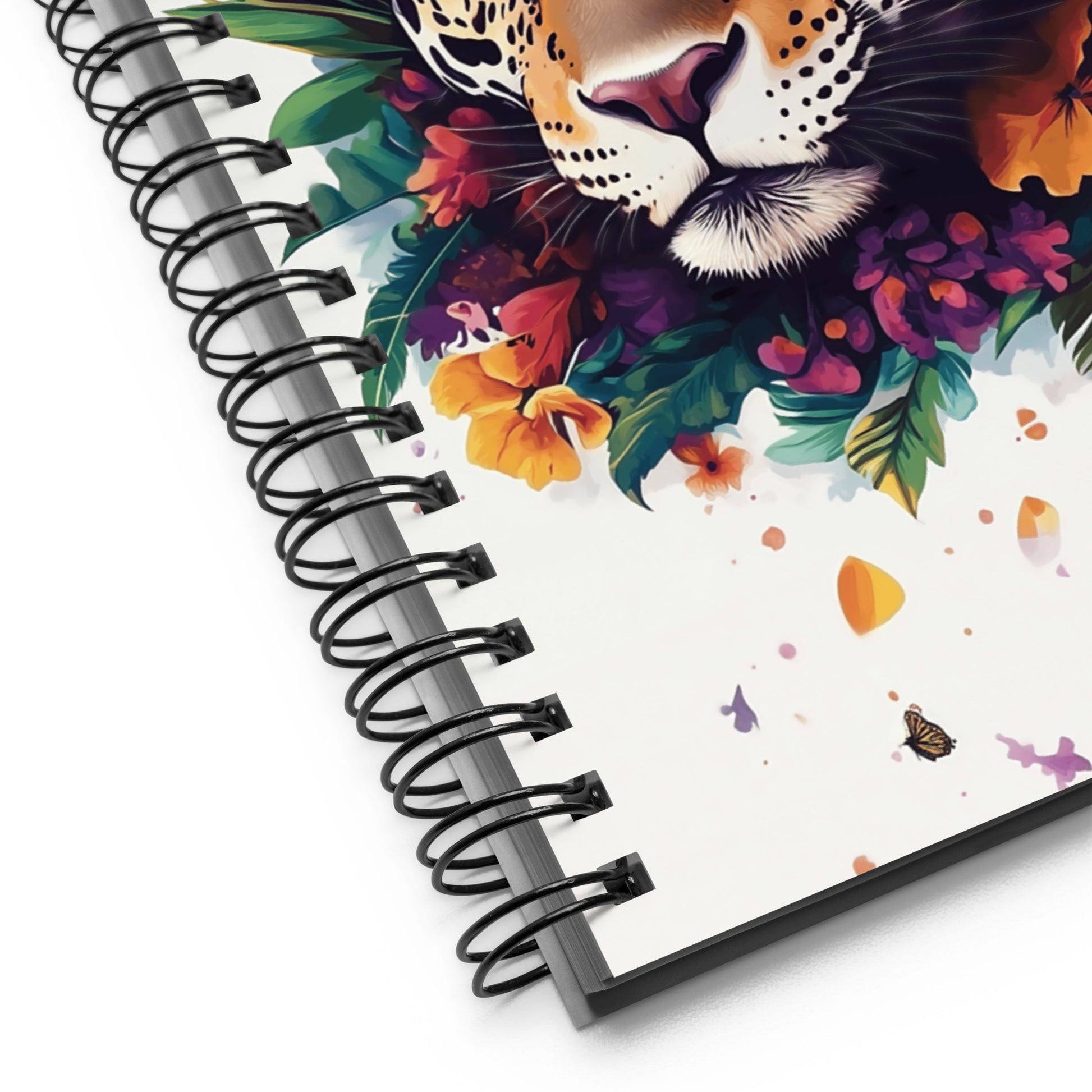 Spiral notebook with a jaguar and floral design on the cover. 