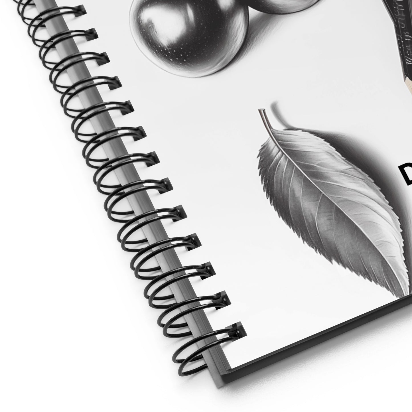 Spiral-bound notebook with a detailed pencil drawing of a leaf and fruit on a white background. 