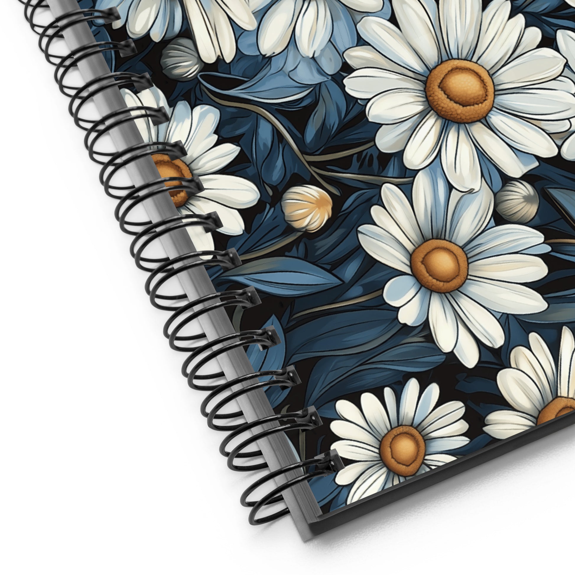 Spiral notebook with a daisy design by Sweet and Savage and spiral binding on a white background. 