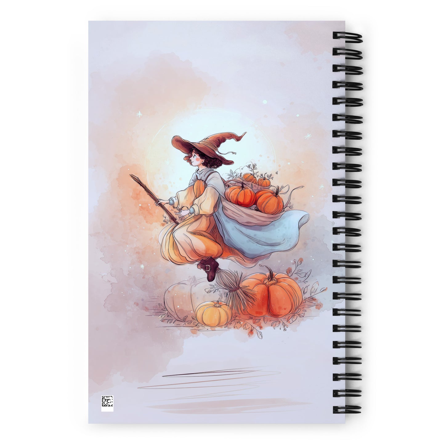 Spiral Notebook with a witch illustration and pumpkin design on a white surface by Sweet and Savage. 