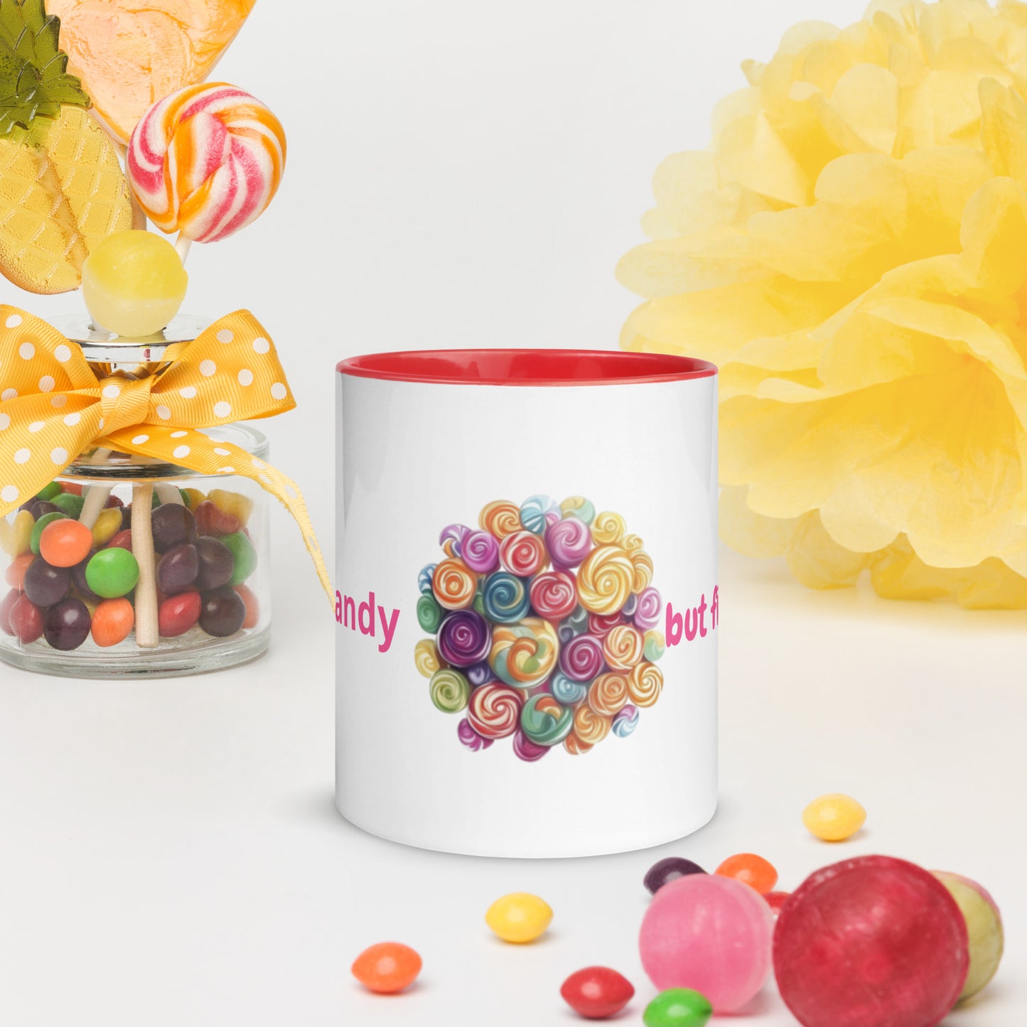 White ceramic mug with a vibrant red rim and handle, featuring a colorful circular illustration of assorted candies and sweets.