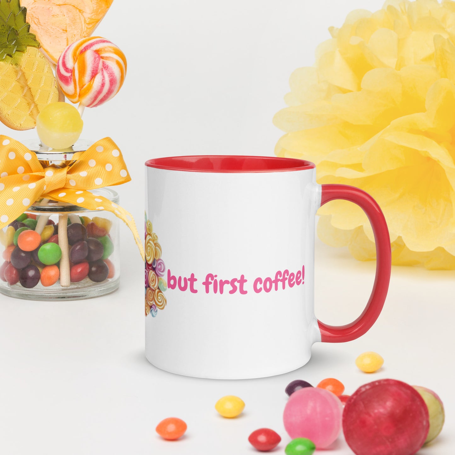 White ceramic mug with a vibrant red rim and handle, featuring a colorful circular illustration of assorted candies and sweets.