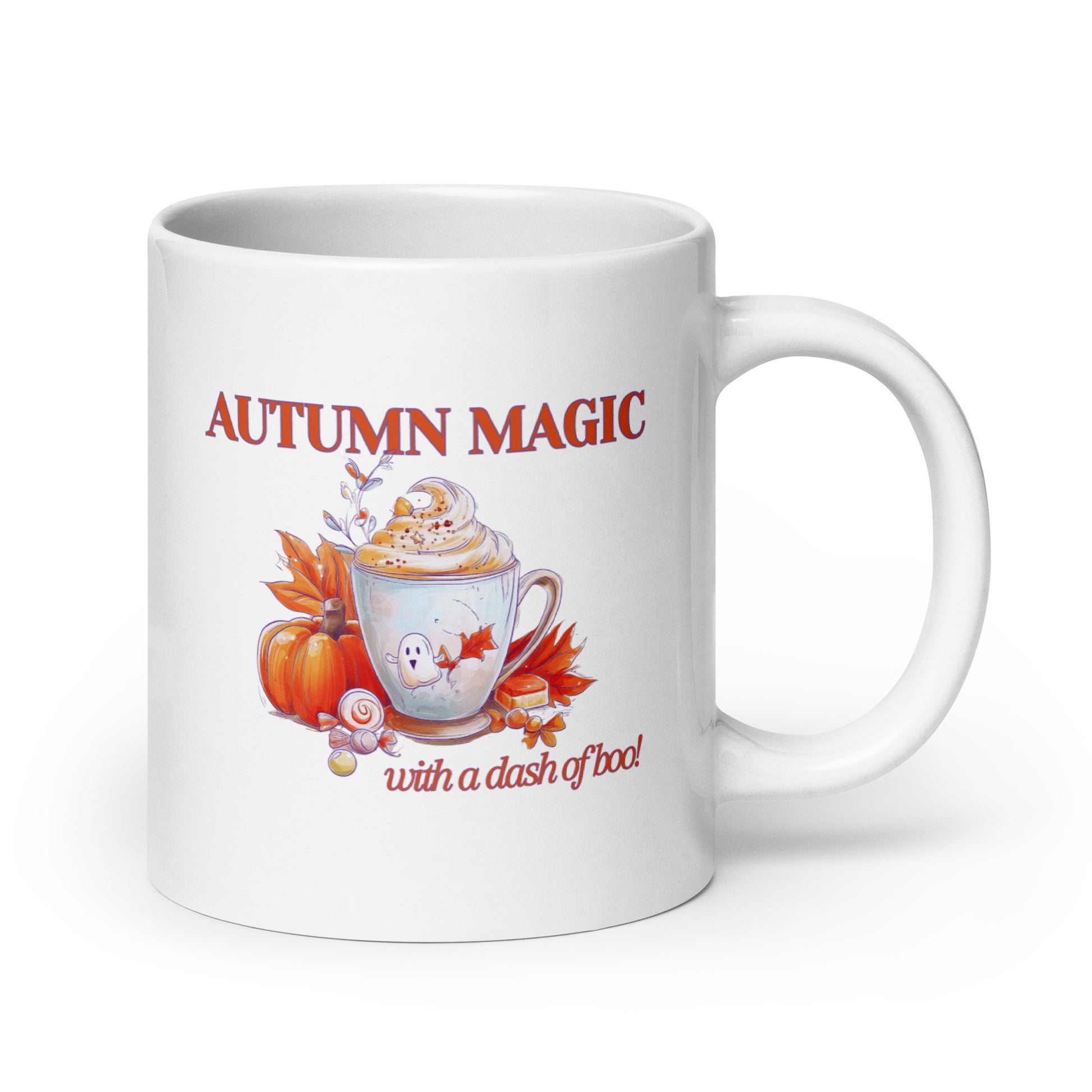 A white ceramic mug with a handle, featuring a printed autumn-themed graphic that reads 'AUTUMN MAGIC with a dash of boo' above and below an illustration of a hot cocoa cup with whipped cream, a pumpkin, and fall leaves.